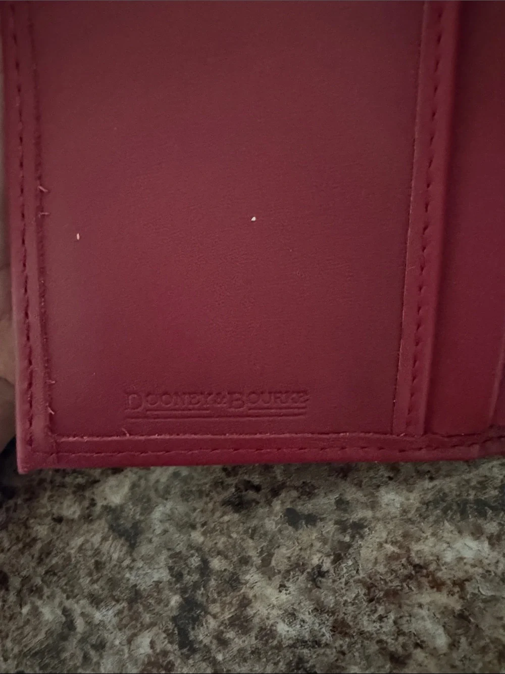 Dooney & Bourke Burgundy Leather wallet with Gold Logo
